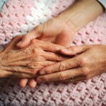 Holding Hands with Elderly Patient